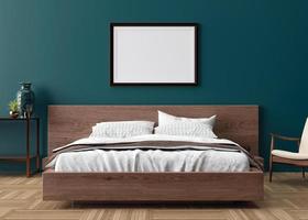 Blank picture frame on blue wall in bedroom. Mock up poster frame in modern interior. 3D render, 3D illustration. Free space, copy space for your design. Wooden bed, armchair, sideboard. photo