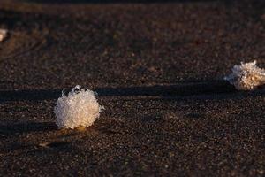 Baltic Sea Coast With Pebbles And Ice at Sunset photo