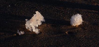 Baltic Sea Coast With Pebbles And Ice at Sunset photo