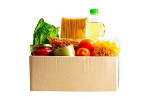 Foodstuffs in donation box isolated on white background with clipping path for volunteer to help people. photo