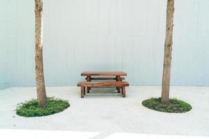 empty wood outdoor patio table and chair set photo