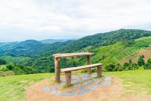 wood bar and chair with mountain hill background photo