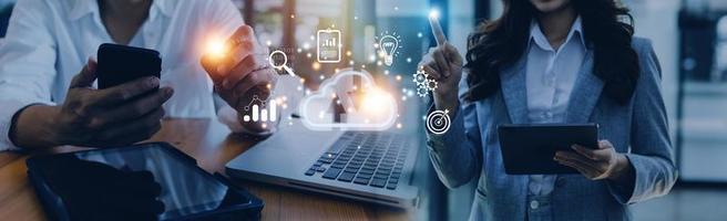 man use Laptop with cloud computing diagram show on hand. Cloud technology. Data storage. Networking and internet service concept. photo