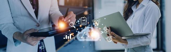 man use Laptop with cloud computing diagram show on hand. Cloud technology. Data storage. Networking and internet service concept. photo