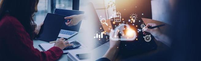 man use Laptop with cloud computing diagram show on hand. Cloud technology. Data storage. Networking and internet service concept. photo