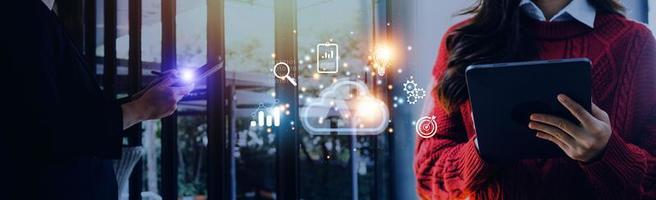 man use Laptop with cloud computing diagram show on hand. Cloud technology. Data storage. Networking and internet service concept. photo