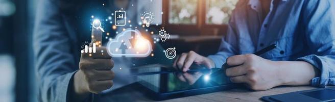 man use Laptop with cloud computing diagram show on hand. Cloud technology. Data storage. Networking and internet service concept. photo