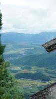 The old temple view with the ancient Chinese buildings located on the top of the mountains photo