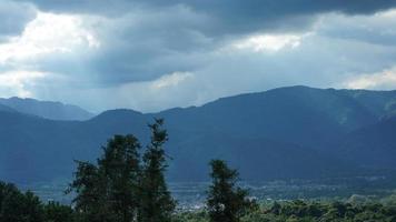 The beautiful mountains view with the cloudy sky and valley among them photo