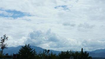 The beautiful mountains view with the cloudy sky and valley among them photo