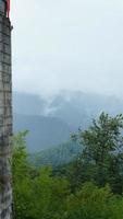 The raining mountains view with the foggy and misty raining droplets photo