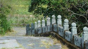 The old stone bridge view with the ruined sculptures in China photo