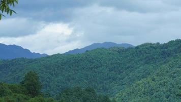 The beautiful mountains view with the cloudy sky and valley among them photo