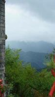 The old temple view with the ancient Chinese buildings located on the top of the mountains photo