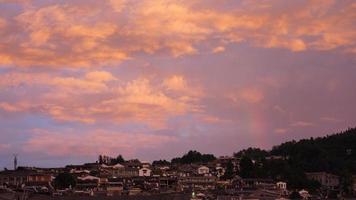 The colorful rainbow rising up in the sky after the summer rainning photo