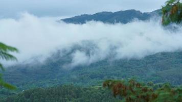 The beautiful mountains view with the cloudy sky and valley among them photo