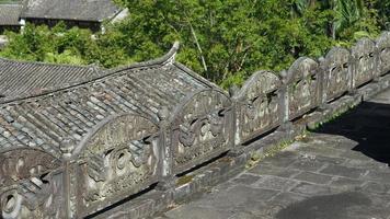 The old temple view with the ancient Chinese buildings located on the top of the mountains photo