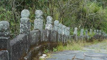 The old stone bridge view with the ruined sculptures in China photo