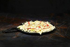 Delicious pizza  isolated on black background photo