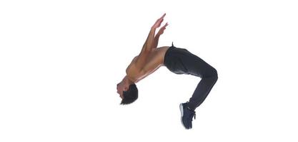 Cool young break dancer performing in studio on white background. photo