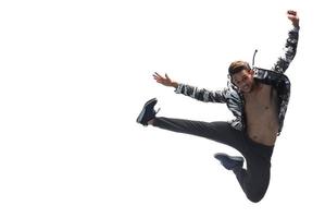 Cool young break dancer performing in studio on white background. photo