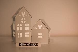 White winter banner with toy houses and december sign. Beginning of winter. Season holidays.Place for text photo