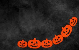 Dark mystery halloween flat lay with orange pumpkins.Copy space banner photo
