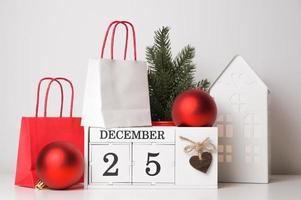 Christmas card with calendar,fir tree,ornaments. Winter holidays concept photo