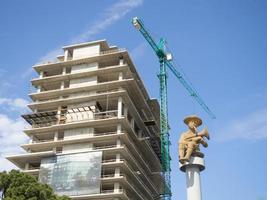 Building under construction. Monument to the boy. The base of the building. photo