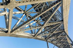 Abstract composition with metallic structure of bridge in Porto Portugal against clear sky photo