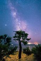 Scenic view of the Milky Way in Saint Tropez bay area in a summer night photo