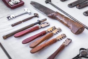 Close-up of old work tools at a flea market in Provence photo