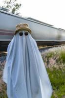 ghost on train tracks with train passing behind, at sunset, mexico latin america photo