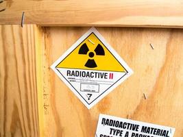 Radiation label beside the transport wooden box Type A package photo