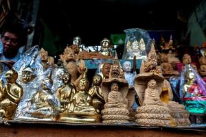 Wood products carved in the form of Buddha and deities photo