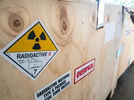 Radiation label beside the transport wooden box Type A package photo