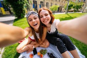 Beautiful women takes a picture with a wonderful park view photo