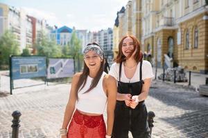 Two funny friends outdoors in the street photo