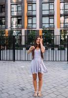 Woman on the background of large building photo