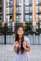 Woman on the background of large building photo