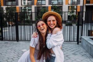 Two girlfriends having fun and fooling around photo