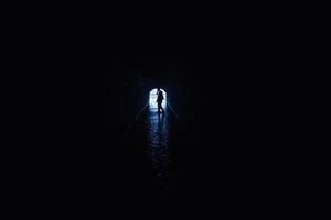 Silhouette of a woman in a tunnel photo