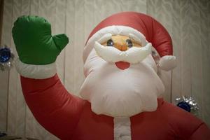 Inflatable Santa Claus. New Year game. Growth doll with air. photo