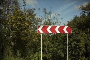 Sharp turn of road. Sharp turn sign. Highway infrastructure. photo