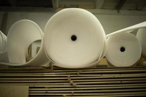 Boards and thin parallon. Parallon roll in stock. White material. photo