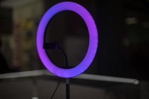 Purple lamp for blogging. Round LED lamp. photo