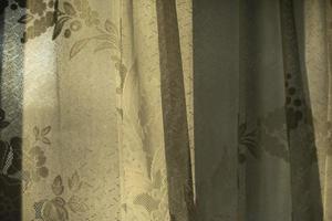 Curtains on window. Light through fabric. photo