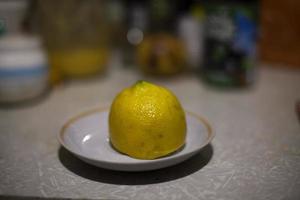 Lemon lies on the table. photo