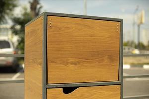 Garbage box on street. Wooden box. Waste disposal door. photo