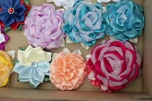 Fabric bows. Handmade hair clips. Flowers from fabric flaps. Hair ornament. photo